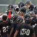 The Ypsilanti Community High School football team huddles during practice in the rain at the school on Monday, August 12, 2013. Melanie Maxwell | AnnArbor.com